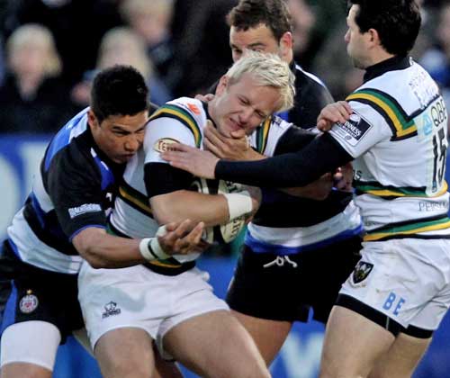 Northampton's Shane Geraghty is shackled by the Bath defence