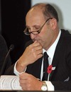 NZRU chairman Jock Hobbs studies the agenda at the union's AGM