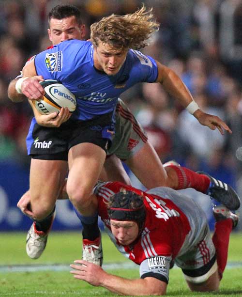 Western Force winger Nick Cummins is tackled by the Crusaders' Thomas Waldrom