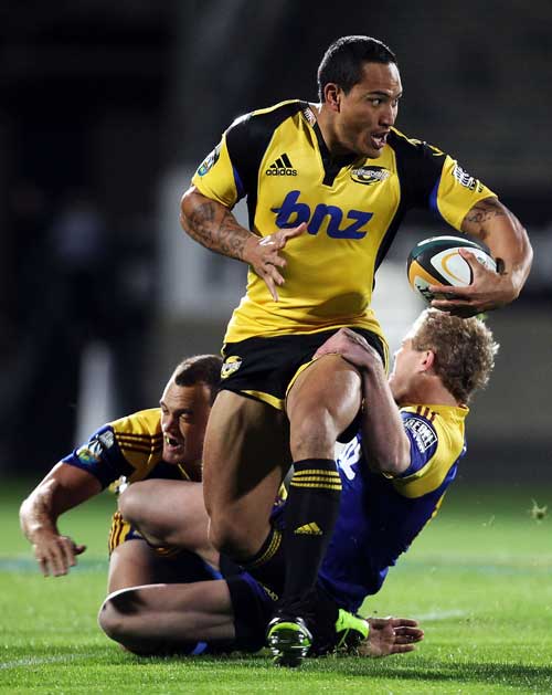 Hurricanes wing Hosea Gear powers through a tackle