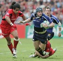 Leinster's Jamie Heaslip is felled by the Toulouse defence