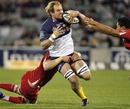 The Brumbies' Rocky Elsom takes on the Reds' defence