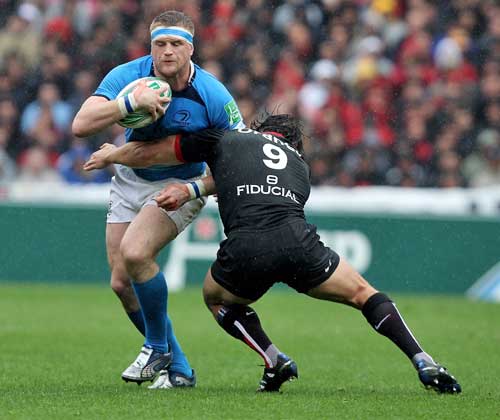 Leinster's Shane Heaslip is tackled by Toulouse's Byron Kelleher