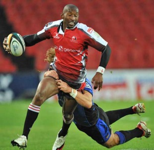 The Lions' Tonderai Chavhanga is tackled by the Western Force's Nick Cummins, Lions v Western Force, Super 14, Ellis Park, Johannesburg, South Africa, May 1, 2010