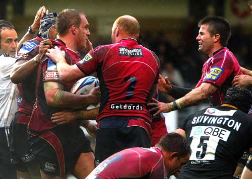Cardiff Blues prop Gethin Jenkins is congratulated after scoring a try
