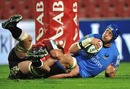 Western Force lock Nathan Sharpe is tackled by the Lions' George Earl