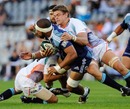 The Blues' Viliame Maafu is tackled by the Cheetahs' Juan Smith
