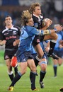 The Bulls' Wynand Olivier tackles the Sharks' Patrick Lambie 