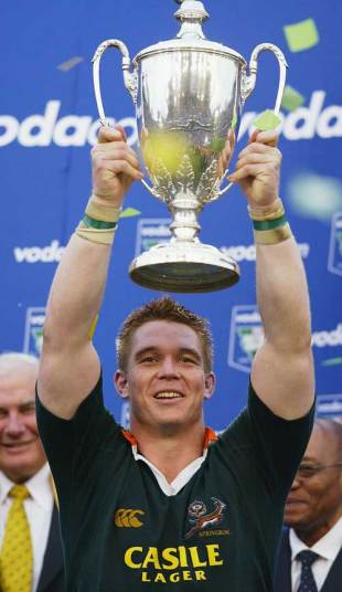South Africa skipper John Smit lifts the 2004 Tri Nations trophy, South Africa v Australia, Tri Nations, Kings Park, August 21 2004.