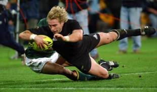 New Zealand scrum-half Justin Marshall dives in to score during the All Blacks 40-21 victory over South Africa, New Zealand v South Africa, Tri Nations, Westpac Stadium, July 20 2002.