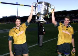 Australia's second-row partnership of John Eales and Justin Harrison poses with the Bledisloe Cup, New Zealand v Australia, Tri Nations, Carisbrook, August 11 2001.