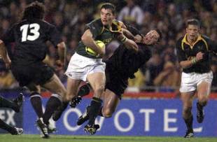 South Africa scrum-half Joost van der Westhuizen hands off his opposite number Byron Kelleher, New Zealand v South Africa, Tri Nations, Eden Park, August 25 2001.