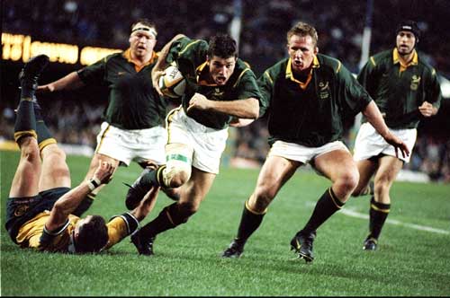 Joost van der Westhuizen charges forward with the ball