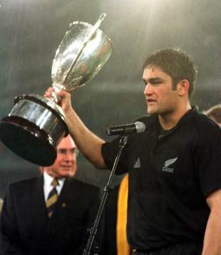 New Zealand captain Taine Randell lifts the 1999 Tri Nations trophy, Australia v New Zealand, Tri Nations, Stadium Australia, August 28 1999.