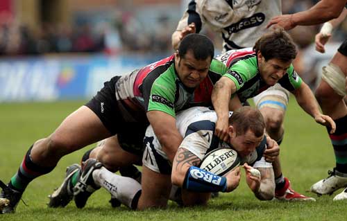 Sale's Lee Thomas gets a welcome from the Quins' defence
