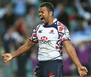 The Waratahs' Kurtley Beale celebrates his side's victory over the Hurricanes