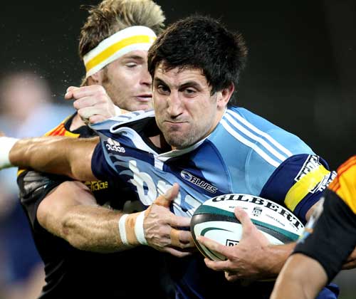 Blues fullback Paul Williams battles against the Chiefs' defence
