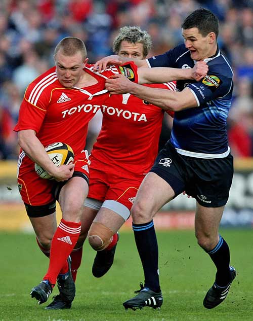 Munster's Keith Earls stretches the Leinster defence