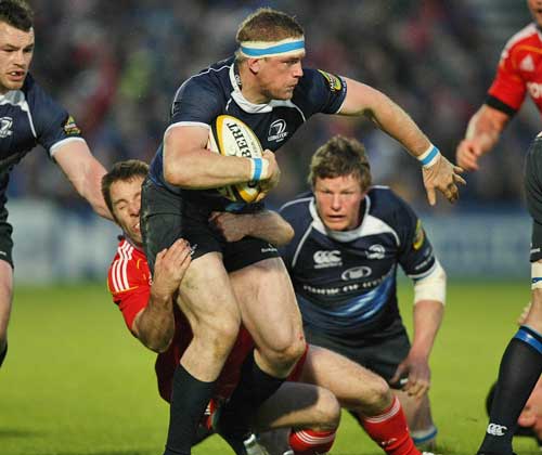 Leinster's Jamie Heaslip stretches the Munster defence