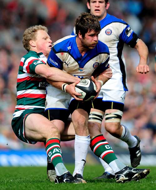 Bath's Luke Watson is tackled by Leicester's Scott Hamilton
