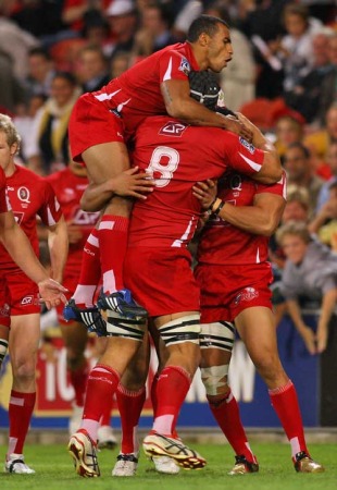 The Reds' Digby Ioane is engulfed after scoring, Reds v Highlanders, Super 14, Suncorp Stadium, Brisbane, Australia, May 15, 2010