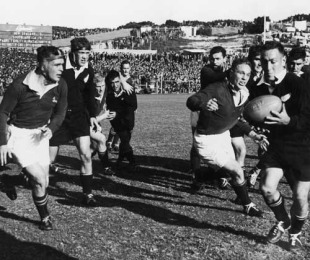 Colin Meads takes on the South Africa defence, from left to right Abe Malan, Ron Horsley, Fanie Kuhn, Don Clarke, Dick Lockyear, Hugo van Zyl, Avril Malan, MacEwan, Kevin Briscoe, Colin Meads and Martin Pelser, South Africa v New Zealand, Boet Erasmus, Port Elizabeth, South Africa, August 31, 1960