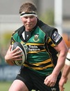 Northampton's Dylan Hartley takes on the Saracens defence
