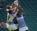Loloi Lui and Reupena Levasa of Samoa jump for the ball against the United States