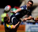 Scotland's Greig Laidlaw gets the offload away against Australia