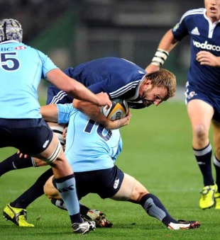 Stormers lock Andries Bekker is shackled by the Waratahs' defence