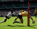 Australia's Clinton Sills scores an acrobatic try during victory over Fiji