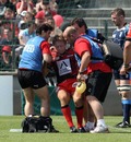 Toulon fly-half Jonny Wilkinson is helped from the field with an injury