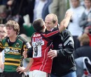 Bath's Neil de Kock embraces the injured Steve Borthwick 