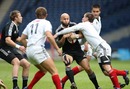 New Zealand skipper DJ Forbes is collared by the Russian defence