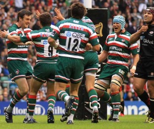 The Leicester Tigers players celebrate with Matt Smith after his try