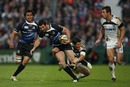 Leinster fullback Rob Kearney is tackled by James Hook
