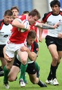 Wales' Craig Hill is tackled by Canada's Dan Harlow