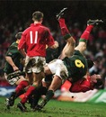 Gareth Thomas is smashed to the ground by South Africa's Corne Krige