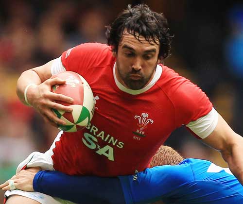 Wales flanker Jonathan Thomas is tackled