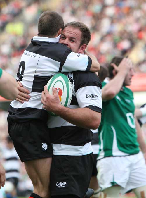 Barbarians skipper Xavier Rush is congratulated after scoring