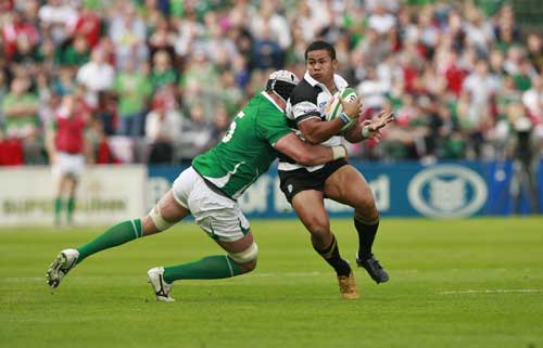 Barbarians wing David Smith is shackled by the Ireland defence