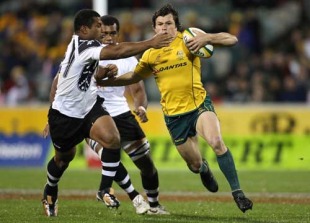 Australia wing Adam Ashley-Cooper is caught by a Fijian tackler, Australia v Fiji, Canberra Stadium, Canberra, June 5, 2010