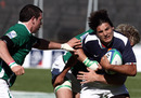 Romain Barthelemy of France is tackled by Dominic Ryan and John Cooney of Ireland 