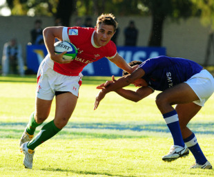 Ashley Beck of Wales breaks a tackle against Samoa