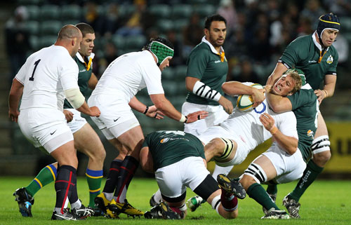 Stephen Hoiles tackles Chris Robshaw during the match between the Australian Barbarians and England 