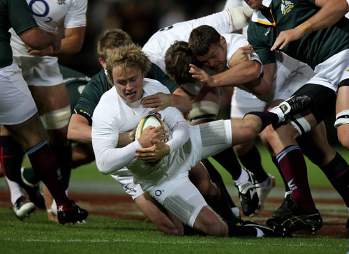 Matthew Tait is tackled during the match between the Australian Barbarians and England 