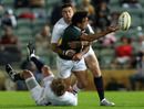 Will Chambers offloads in the tackle for the Australian Barbarians