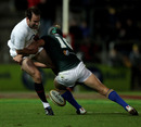 England's Charlie Hodgson loses the ball in the tackle against the Australian Barbarians 