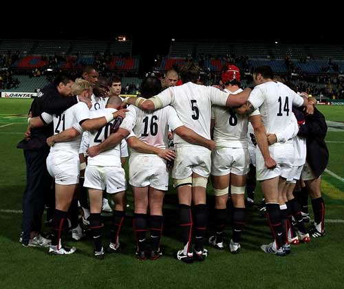 A dejected England huddle at the final whistle