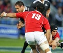 New Zealand Maori's Luke McAlister is shackled by the NZ Barbarians